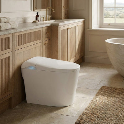 Tresani Prime floor-standing Japanese smart toilet in gloss white, in a warm oak bathroom with a stone bath and countryside views