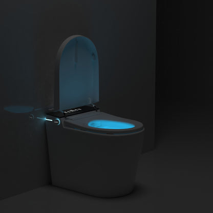 Origin smart toilet at night with the lid open and a soft blue night-light in the bowl