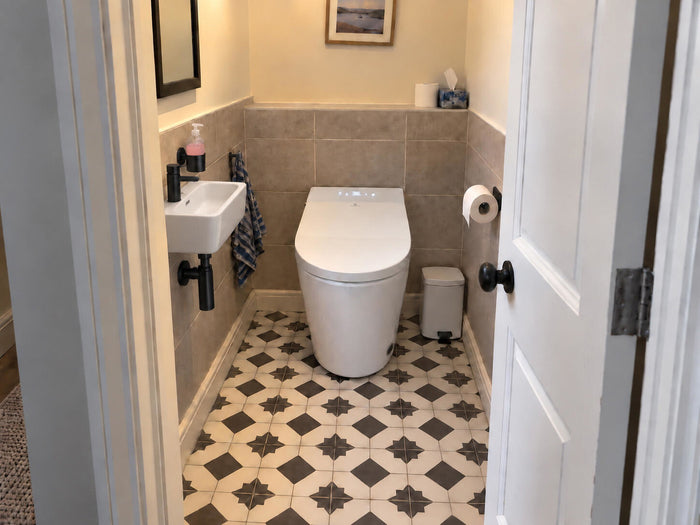 Customer photo — Tresani in a patterned-tile cloakroom