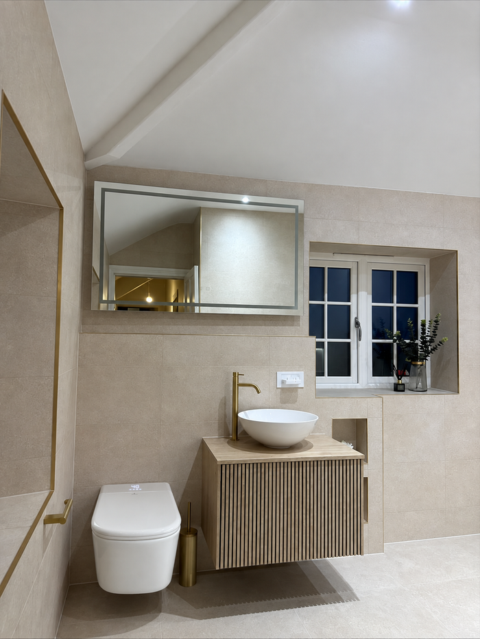 Customer photo — wall-hung Tresani in a warm stone bathroom