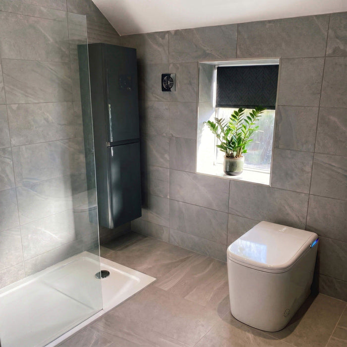 Customer photo — Tresani in a light-filled grey bathroom